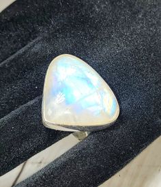 "Natural AAA Grade Multi Color Flash Moonstone Pear .925 Sterling Silver Ring Size 9.5 10.2 Grams 7/8\" x 1\" GE25.  We are known for our high quality Moonstone and our current inventory is the prettiest we've ever had in stock. Our large multi color Moonstone is very hard to find and is expensive when you do find the kind of quality we look to purchase! This is a hand selected natural stone, the exact one shown in picture.  The sterling silver is .925 and stamped.  Each piece is hand made by artisans in my shop.  The quality of the stones and the silver workmanship is impressive.  Please look at other items in my store.  I sell ready made jewelry with hand crafted silver work, pendants with a sterling silver bails and beautiful unique cabochons for jewelry wire wrapping and weaving. You w Iridescent Sterling Silver Moonstone Ring, Bohemian Nickel-free Moonstone Ring, Nickel-free Spiritual Moonstone Ring, Silver-tone Opal Ring With Cabochon Moonstone, Spiritual Moonstone Cabochon Ring, Moonstone Ring Sterling Silver, Hippy Gifts, Silver Work, Moonstone Ring