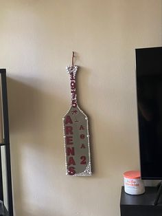 a bottle hanging from the side of a wall