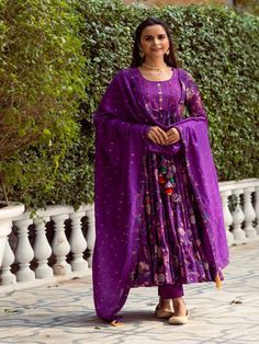 Purple Floral Printed Tiered Cotton Silk Anarkali Set (Set of 3) By Rivaaj now available at Trendroots Anarkali Purple Palazzo Set With Gota Work, Navratri Purple Palazzo Set With Cutdana, Purple Anarkali Palazzo Set With Cutdana, Unstitched Maxi Length Traditional Wear With Gota Work, Unstitched Chanderi Bollywood Anarkali Set, Unstitched Bollywood Chanderi Anarkali Set, Designer Purple Chanderi Palazzo Set, Unstitched Maxi Length Anarkali Set With Gota Work, Anarkali Slub Silk Set With Pallu