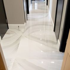 the hallway is clean and ready to be used for business purposes in this company's office building