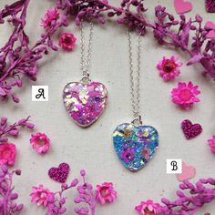 "Wear a piece of nature with one of these unique, handmade necklaces 🌿💜 ♡ Beautifully handcrafted with real flowers encased in resin with super sparkly glitter ✨ ♡ Each heart measures 2.5cm H x 2cm W  ♡ Attached to an 18\" Sterling silver chain,  ♡ Only 3 available - Red, Pink & Blue  ♡ Comes presented on a backing card with an Organza bag or the option of a lilac gift box for £1 extra - please see photos attached If you have any questions, please drop me a message 💜 Have a lovely day, Charlotte x" Unique Sterling Silver Necklace For Gift, Unique Sterling Silver Necklace As Gift, Sterling Silver Jewelry With Natural Inclusions As Gift, Unique Heart Charm Jewelry Gift, Handmade Flower Pendant Jewelry For Valentine's Day, Pressed Flowers Jewelry For Valentine's Day Gift, Handmade Flower Necklace For Valentine's Day, Handmade Round Pendant Necklace For Keepsake, Pressed Flowers Jewelry Gift For Valentine's Day