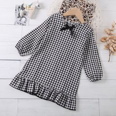 Product Title: Girls Bow Long Sleeve Plaid Casual Dress Girls Dress Keyword Tag: Wholesale Baby Boutique Suppliers Usa* Soft Feeling & Cozy Comfortable* Package Package Included: 1 Top + 1 Pants* Fabric & Fabric: 97% Polyester, 3% Spandex* Available for Machine Wash as well as TumbleDry* Imported * Imported Are you look for a best quality and cheapest dress? Then Girls Bow Long Sleeve Plaid Casual Dress Girls Dress Wholesale is the best one for you! The New style with amazing designs for reflect Long Sleeve Cotton School Dress, Long Sleeve Ruffled Dress For School, Cute Winter Dress For School, White Long Sleeve School Dress, Casual Winter School Dress, Long Sleeve Winter School Dress, Casual Winter Dresses For School, Black School Dresses For Fall, Black Dresses For School In Fall