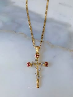 This is a stunning 18k tricolor gold plated cross inspired by roses, leaves, and rose stems.  The chain is our classic 18k gold plated figaro chain. Please select your length.  Including the bail, the cross is 6 cm long, and 3 cm wide. Original Price: $50 Beautiful Cross Necklace, Flower Cross Necklace, Rose Gold Cross Necklace, Unique Cross Necklace, Cross Necklace Aesthetic, Cross Necklace Womens, Cross Ideas, Dope Jewelry Accessories, Pretty Jewelry Necklaces