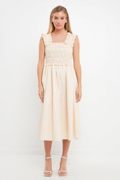 ¡Sé la reina del baile con el vestido midi con tirantes y volantes! Este encantador vestido de verano presenta tirantes con volantes y un corpiño fruncido para una silueta femenina y favorecedora. La falda de largo midi está forrada, lo que añade elegancia y comodidad adicionales. Muestra tu figura mientras te mantienes fresco: perfecto para los divertidos días de verano. Se recomienda lavar cuidadosamente a mano con agua fría para este artículo. ¡Salga con estilo con nuestro clásico y único vestido midi con tirantes con volantes en los hombros!



 Tirantes con volantes

 Forrado

 Corpiño fruncido

 Lavado de manos en frio

 No usa blanqueador

 No secar en secadora

 Plancha baja

 Exterior: 100% algodón

 Forro: 80% Poliéster 20% Algodón

 Exclusivo de elástico









 JJ878D Spring Midi Dress With Smocked Bodice And Ruffle Sleeves, Spring Ruffle Dress For Garden Party With Smocked Bodice, Spring Ruffle Sleeve Dress With Smocked Back, Feminine Ruched Midi Dress With Ruffled Straps, Spring Ruched Ruffle Midi Dress, Summer Midi Dress With Smocked Bodice And Ruffle Sleeves, Spring Dresses With Gathered Neckline And Ruffled Straps, Sundress Midi Dress With Ruffle Hem And Straps, Sundress Midi Dress With Ruffled Straps And Ruffle Hem