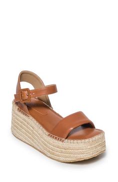 Rich leather straps enrich an espadrille-inspired sandal lofted by a jute-wrapped platform and integrated wedge heel. 3" heel; 1" platform Cushioned footbed Leather upper and lining/synthetic sole Made in Brazil Beach Season Natural Platform Espadrilles, Brown Leather Platform Espadrilles, Synthetic Platform Slip-on Espadrilles, Slip-on Platform Wedge Espadrille Sandals, Beige Platform Espadrille-style Sandals, Bearded Lady, Espadrilles Platform, Resort Outfit, Perfume Gift Sets