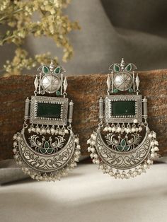 These beautiful statement emerald green dangler earrings will compliment any outfit! Made in high quality German silver, these are light weight and easy to wear.  For any queries, please feel free to contact us. Happy shopping! Luxury Green Danglers For Reception, Cheap Silver Earrings For Festival, Cheap Heavy Earrings As Gift, Cheap Silver Danglers For Festive Occasions, Cheap Green Earrings For Festive Season, Cheap Heavy Earrings For Festivals, Cheap Heavy Earrings For Gift, Festive Dangle Jewelry, Luxury Silver Danglers For Festive Occasions