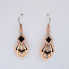 Inspired by the beauty of art and nature, pure copper products are handcrafted jewelry and unique gifts using an exclusive ancient copper craft. All of handmade items are silver plated and individually diamond cut on copper. Each piece has a protective acrylic coating to prevent tarnishing so no polishing is required. Earring wires are hypoallergenic, surgical steel. 99% pure copper jewelry is fine in style and should be handled carefully. Here are the tips that will help you to enjoy your jewelry for many years: * Put on jewelry after dressing and take off first when undressing. * Avoid scratches. * Take off your jewelry while having shower. * Keep away from detergent products. * Keep away from chemicals. * Pay attention on hard surfaces. * Keep it in its own bag. Handmade Art Deco Dangle Earrings, Luxury Art Deco Pierced Earrings, Art Deco Dangle Pierced Earrings, Handmade Brass Art Deco Earrings, Art Deco Dangle Brass Earrings, Detergent Product, Copper Crafts, Art Deco Earrings, Art Deco Inspired