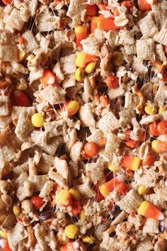 a mixture of cereal with candy corn and candies