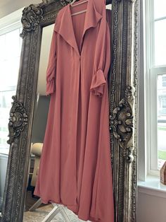 Blush pink abaya with collar and simple flared sleeves for an edgy yet feminine look If you're looking for a great quality Abaya to look chic and modest, then you're at the right shop 🌷 We are certain we will not disappoint! We chose the best materials and worked with the most experienced tailors and designers to bring to you elegant, modern, and modest styles!  Express your modest style with our elegant colorful abayas  Come with scarf  Made in Bahrain Long Pink Abaya For Eid, Elegant Long Sleeve Abaya For Spring, Pink Long Abaya For Eid, Elegant Long-sleeve Abaya For Spring, Chic Long Sleeve Fall Abaya, Modest Pink Maxi Dress For Fall, Pink Long Sleeve Abaya For Eid, Modest Pink Abaya For Spring, Pink Modest Abaya For Spring