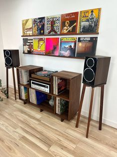 the entertainment center has speakers and records on it