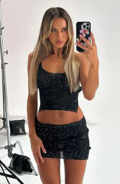 My Little Secret Sequin Knit Mini Skirt Black Sparkly Matching Set, Black Mini Skirt New Years Outfit, Outfit Ideas With Black Mini Skirt, Sparkly Going Out Top, Black Sparkly Skirt Outfit, Concert Crowd Aesthetic, Leather Mini Skirt Outfit Night, 21 Bday Outfit, Black Sequin Outfit