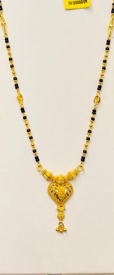 "Black beads chain necklace, 916 Yellow Gold GOLD PURITY : 916 gold purity Weight: 13.40 grams Size : 24\" inches Length Colour : YELLOW GOLD Hallmark: Hallmarked 916 stamp Hook: '' no hook. (Wear over head) Design : Mangalsutra necklace with black beads. Authentic 916 Gold by Mbrilliance FAQs Q: Is it real gold? A: yes it's real authentic genuine 916 gold Q: can pawn? A: yes it's pawnable ⭐️GoForGold⭐️" Luxury 22k Gold Traditional Mangalsutra, 22k Yellow Gold Necklaces For Diwali, 22k Yellow Gold Necklace For Diwali, Yellow Gold 22k Necklace For Diwali, Traditional Yellow Gold-plated Necklace, 22k Gold Necklaces For Puja, 22k Gold Necklace For Puja, 22k Gold Locket Necklace In Temple Jewelry Style, Yellow Gold Necklace With Intricate Design For Puja