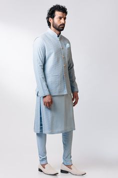 Editor's Note This set features a Side Paneled Embroidered Kurta Set With Embroidered Nehru Jacket Fabric: Chanderi Silk, Cotton Satin Lycra Color: Blue Care: Dry Clean Only Customize Your Outfit Can't find the size you're looking for? No stress. Just select size "Custom" while adding the item to your cart. We will follow up with you for your body measurements. To request a color or design customizations, please contact our customer care by using our "Ask us a question" form or simply email us. Cotton Bandhgala With Resham Embroidery Long Sleeve, Embroidered Cotton Bandhgala In Blue, Embroidered Blue Cotton Bandhgala, Blue Cotton Nehru Jacket With Zari Work, Cotton Long Sleeve Bandhgala With Zari Work, Cotton Bandhgala With Zari Work And Long Sleeves, Cotton Long Sleeve Outerwear For Eid, Nehru Jacket With Embroidered Sleeves For Eid, Embroidered Sleeve Nehru Jacket For Eid