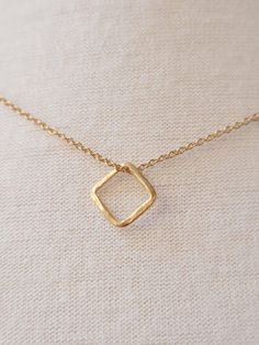 ESSENTIAL ELEGANCE A simple and small square is the main figure of this fine 24-karat gold-plated silver necklace with 3 microns thickness. LESS IS MORE In a world overloaded with stimuli, it is essential to reduce the superfluous and focus on what really matters. If you agree that less is more... This pendant is for you. CARE IN EVERY DETAIL Our pieces are made with great care and dedication, paying special attention to ensuring that the production process from the original design to the final Square Gold Jewelry Gift, Dainty Gold Square Jewelry, Square Gold Jewelry For Gifts, Square Gold Minimalist Jewelry, Minimalist Square Gold Jewelry, Square Gold Necklace For Everyday, Everyday Square Gold Necklace, Canada Trip, Small Necklace