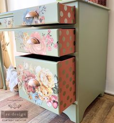 an old dresser painted with flowers and polka dots