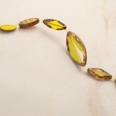 Find the Smooth Yellow Czech Glass Oval Bead Mix by Bead Landing™ at Michaels. These striking oval Czech glass beads will add a nice hint of sunshine to your accessory creations. On their own or mixed with complimentary stones and charms, these beads will make lovely necklaces, bracelets and earrings and are also a wonderful accent for home décor projects and other crafts. These striking oval Czech glass beads will add a nice hint of sunshine to your accessory creations. On their own or mixed wi Faceted Oval Beads For Jewelry Making, Amber Oval Beads Necklace For Jewelry Making, Amber Oval Beaded Necklaces For Jewelry Making, Czech Glass Oval Beads For Jewelry Making, Glass Spacer Beads In Oval Shape, Lovely Necklace, Czech Glass Beads, Decor Project, Czech Glass