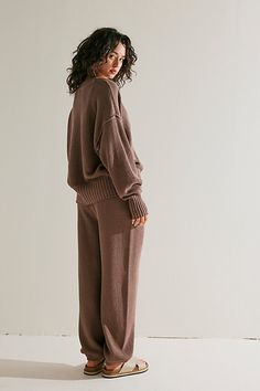 Everyone’s favorite Hailee Sweater Set, now reimagined with a classic cardi! This cozy set from our free-est collection will take you from the beach, to brunch, to lounging, and beyond. **Fit:** Cardi: Relaxed, slightly oversized silhouette; Pants: High-rise, jogger-inspired fit **Features:** Cardi: Ribbed trimming, button-up closures, V-neckline, dropped shoulders; Pants: Pull-on design, loose balloon silhouette, banded hemlines **Why We ❤ It:** Our softest Hailee knit fabric is a true must-hav Hailee Sweater Set, Brown Lounge, Balloon Silhouette, Outing With Friends, Polished Style, Comfy Outfit, Walk In The Park, Oversized Silhouette, Brown Sweater