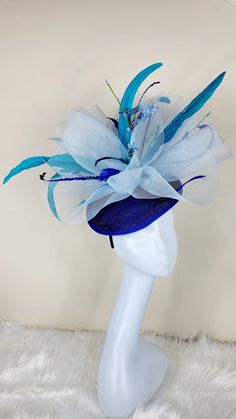 Beautiful multi blue color Fascinator with feathers and flowers. Style to go with a variety of outfits: bridesmaids, cocktail party, Kentucky Derby, Rehearsal dinner, Easter and church outfits. Ones with hair clip and headband. Are you trying to match an outfit? Send a picture and I will help you find a best hat to match your outfit. - Rare find - Ready to ship - Lightweight - Free Shipping - Fast shipping - Customize by adding different color flowers and or feathers Check my store for for style Cheap Adjustable Blue Costume Hats And Headpieces, Luxury Blue Costume Hats And Headpieces For Summer, Luxury Blue Headpiece For Kentucky Derby, Luxury Blue Headpieces For Kentucky Derby, Luxury Blue Hat Bands For Kentucky Derby, Luxury Blue Hat For Kentucky Derby, Luxury Blue Costume Hat For Kentucky Derby, Luxury Blue Costume Hats For Summer, Affordable Fun Blue Hats