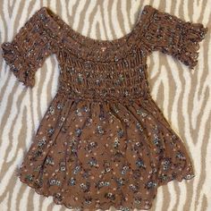 Off The Shoulder Free People Smocked Top. Never Worn. Make An Offer! Casual Off-shoulder Smocked Top For Spring, Brown Off-shoulder Top For Spring, Casual Off-shoulder Smocked Top, Fitted Off-shoulder Smocked Casual Top, Fitted Off-shoulder Casual Smocked Top, Stretch Smock Top For Beach, Casual Smock Brown Tops, Casual Brown Smock Tops, Casual Smocked Short Sleeve Top For Beach