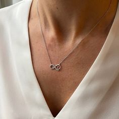 Metal: 925 Sterling silver, 18k yellow or rose gold vermeil. Dimensions of the Infinity: 15mm * 10mm Length of necklace: 40cm + 3cm extension (16" + 1.2" extension). %100 HANDMADE & 925 SILVER A delicate and minimalist 18k gold vermeil necklace. The necklace is 925 Sterling Silver and all the sparkly stones on this gorgeous necklace are cubic zirconia. This beautiful necklace is available in three different colours and comes with a special jewellery box. It is perfect for every day wear and also Elegant Rose Gold Infinity Necklace, Cubic Zirconia Infinity Necklace For Anniversary, Minimalist Infinity Jewelry For Formal Occasions, Silver Infinity Necklace In Dainty Style, Sterling Silver Infinity Necklace With Adjustable Chain, Sterling Silver Infinity Necklace In White Gold, Silver Infinity Dainty Necklace, Silver Dainty Infinity Necklace, Dainty Silver Infinity Necklace