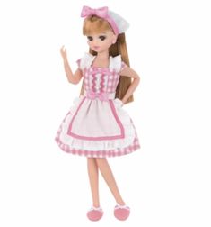 a doll wearing a dress and pink shoes