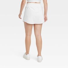 Why we're ALL IN: Woven mid-rise skort with built-in shorts in a regular-fit silhouette makes a cool choice for your active days. Moisture-wicking, quick-dry lightweight fabric helps you stay cool, while a drawcord elastic waistband provides a snug fit. Side pocket provides hands-free convenience and the UPF 50+ rating offers sun protection. All in Motion™: Made for every move, priced for every day. Sporty Short Tennis Skirt For Spring, Casual Summer Tennis Activewear, Casual Tennis Skort Short Length, Short Tennis Skirt For Spring Sports, Sporty Short Leg Skort For Spring, Spring Sports Skort With Short Legs, Casual Stretch Short Length Tennis Skirt, Casual Tennis Bottoms Short Length, Casual Short Tennis Skirt