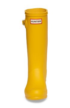 A classic finish perfects a puddle-proof rubber boot equipped with a traction-gripping sole. 1" heel (size 4) 12 1/2" shaft; 14 3/4" calf circumference Hunter boot socks are sold separately A pristine finish and shine is easily restored with regular use of Hunter Boot Buffer or Instant Boot Shine In hot or humid weather, natural latex rubber releases a protective wax film; simply wipe it off with a damp cloth Natural rubber upper/quick-drying nylon lining/natural rubber sole Imported Yellow Weatherproof Rain Boots For Outdoor, Waterproof Yellow Boots For Fall, Yellow Waterproof Rain Boots, Yellow Waterproof Boots For Fall, Yellow Insulated Boots With Round Toe, Yellow Insulated Round Toe Boots, Hunter Boots Socks, Hunter Kids, Hunter Boot