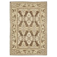 a brown and white rug with an ornate design on the bottom, in front of a white background