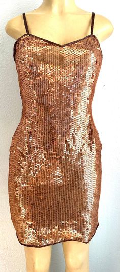 This elegant sequined dress is hand beaded to perfection with sequins and beads all around.  This is for sure an elegant dress for special events, weddings, parties, anniversaries, romantic dinners, red carpets, etc Glamorous Embellished Sequin Fabric For Prom, Glamorous Embellished Sequin Dress For Party Season, Glamorous Embellished Sequin Dress For Prom, Evening Embellished Sleeveless Sequin Fabric, Embellished Sequin Cocktail Dress For Prom Season, Embellished Sequin Dress For Cocktail And Prom Season, Embellished Sequin Fabric For Prom And Party Season, Beaded Dress For Prom And Party Occasions, Fitted Shimmer Sequin Dress For Prom