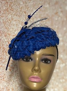 Royal Blue Flower Fascinator Half Hat for Church head covering, Tea Party, Wedding, and other Special Occasions  Accented with blue veil netting, rhinestone hat pin, feather and faux pearl. The hat pin may vary and is for decorative purposes only. The hat is affixed to the head via a hat string. Available in 2 sizes: 8 X 5.5 inches  10 X 7 inches Mannequin is wearing the 8 by 5.5 inches. Handmade Gifts for mom, sister, wife, or yourself. SHIPPING  All items for free shipping will be shipped via Blue Mini Hats With Handmade Flowers For Royal Ascot, Blue Fascinator With Handmade Flowers For Kentucky Derby, Blue Handmade Flowers Fascinator For Races, Blue Mini Hat Headband For Spring, Blue Adjustable Fascinator For Wedding, Adjustable Blue Fascinator For Wedding, Blue Summer Wedding Costume Hats And Headpieces, Blue Costume Hats And Headpieces For Summer Wedding, Summer Blue Headpiece With Handmade Flowers