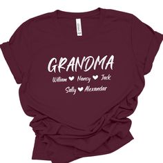 Show your love and pride with our personalized Grandma T-shirt featuring the names of your beloved grandkids. This shirt is not just clothing; it's a heartfelt connection to your cherished grandchildren, keeping them close to your heart wherever you go.  * Gildan Soft Style   unisex shirts.  * Rolled sleeves in pictures is for styling purposes only. * This design will be made with DTF film print. * Printed in the USA. SIZE  * Take a look at the photos to see specific sizing chart for this shirt Custom Text T-shirt For Family Gatherings, Family Matching Short Sleeve T-shirt For Personalized Gift, Customizable Tops For Father's Day, Custom Text Crew Neck T-shirt For Family Reunion, Custom Text Crew Neck T-shirt For Family Gatherings, Custom Text Crew Neck Tops For Family Gatherings, Casual Personalized Tops For Family Gatherings, Customizable Family Matching T-shirts For Family Gatherings, Custom Family Matching T-shirts For Family Gatherings