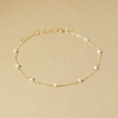 The Mini Loli Bracelet is a must-have accessory for any look. This beautiful mini pearl bracelet adds an elegant touch and can be worn daily or for special occasions. Mix it with your favorite bracelets and give it as a gift to a loved one. Perfect for weddings, brides, and bridesmaids. Handcrafted in USA DETAILS: Hypoallergenic - Water resistant Material: 14k Gold filled, freshwater pearls Sizes : 6" , 7" +1" Adjustable extender chainNotice this is a natural pearl, therefore, it may vary in sha Simple Gold Bracelets For Women, Dainty Bracelets Gold, 2025 Wishlist, Silver Jewelry Necklaces, Gold Bracelet Simple, Dainty Gold Bracelet, Jewelry Accessories Ideas, Bracelets Gold, Gold Bracelet For Women