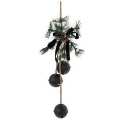 a christmas ornament hanging from a wooden pole