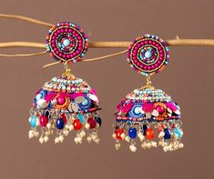 Our Indian earring is silver plated, created with careful attention to detail. The color combination and finishing give it an elegant look & feel. This design is perfect for parties & functions as these handcrafted earrings are specially designed for Indian beautiful brides -Base Metal- Alloy, Silver, Brass -Plating- Silver -Stone- Pearls, Beads & sequin -Sizing-Non Adjustable -Type- Jhumkas Earrings -Light Weight -Color- Multi -FREE Shipping -Gift Wrapping Available -Delivery from a Small Business in India -Handmade Product Skin Friendly- Lead & Nickel Free in compliance with all International Requirements. Gift - Ideal Valentine, Birthday, Anniversary gift for someone you Love/ Best Friend/Girlfriend. Occasion - Festivals, Wedding, Party Wear, Bridal, Perfect For Indian Weddings We Tried Cheap Traditional Multicolor Earrings, Cheap Handmade Festive Jhumkas, Luxury Multicolor Bollywood Jhumkas, Luxury Multicolor Festive Jhumkas, Festive Multicolor Earrings, Multicolor Latkans Earrings For Festivals, Multicolor Chandbali Jhumkas For Pierced Ears, Multicolor Drop Earrings Jhumkas For Festive Season, Beaded Latkans Earrings For Festivals