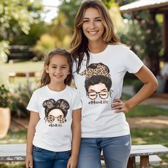 Elevate your twinning game with our Mommy and Me Outfits!  These matching tees are the perfect way to celebrate Mother's Day with your mini-me. Crafted for comfort and style, they're a fun and adorable addition to any mom and daughter's wardrobe.  Get ready to make memories together in these cute and trendy shirts! #MommyAndMeOutfits #MatchingTeeShirts #MotherDaughterMatching #MothersDayGift #GiftForMom ✨ About Bella Canvas 3001: This classic unisex jersey short sleeve tee fits like a well-loved favorite. Soft cotton and quality print make users fall in love with it over and over again. These t-shirts have-ribbed knit collars to bolster shaping. The shoulders are tapered for a better fit over time. Dual side seams hold the garment's shape for longer. ✨Made with 100% Airlume combed and ring Matching Crew Neck Tops For Mother's Day, Matching Short Sleeve Letter Print T-shirt, Matching Short Sleeve T-shirt With Custom Print, Mother's Day Crew Neck T-shirt, Mother's Day Family Graphic Tee T-shirt, Mother's Day Cotton T-shirt With Sublimation Print, Cotton T-shirt With Sublimation Print For Mother's Day, Mother's Day Family Graphic T-shirt, Mother's Day Family Graphic Tee