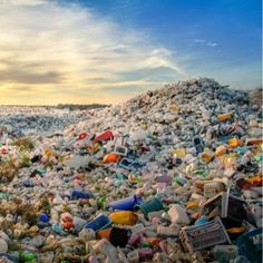 a large pile of trash sitting on top of a beach