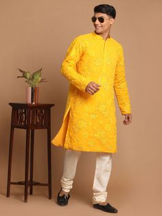 SHRESTHA BY VASTRAMAY Men's Yellow Embroidered Kurta Pyjama Set Look dapper in this ethnic set featuring a yellow kurta with intricate embroidery and a comfortable pyjama. Made with high-quality fabric, this set is perfect for festive occasions or a touch of tradition in your everyday wear. Key Features Embroidered kurta Comfortable pyjama Yellow color Specifications: Sleeve Length - Long Sleeves Top Shape Straight Top Hemline - Straight Top Length - Knee Length Neck Mandarin collar Top- Pattern Fitted Yellow Kurta With Intricate Embroidery, Yellow Kurta For Diwali And Traditional Ceremonies, Yellow Long Sleeve Kurta For Puja, Yellow Kurta With Pallu For Traditional Ceremonies, Yellow Fitted Kurta For Puja, Fitted Yellow Kurta For Puja, Yellow Embroidered Kurta For Diwali, Yellow Kurta With Intricate Embroidery For Festivals, Yellow Cotton Straight Kurta Sherwani