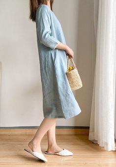 "This slightly A-shaped linen dress is a perfect example of elegance in simplicity. Soft linen fabric, right at knee length, side pockets for convenience, rimmed collar and sleeves in contrast color fabric, all work together for an elegant yet comfy look. - Handmade with 100% medium weight linen - Scoop neck with rimmed collar - Rimmed 3/4 sleeves - Knee Length - Color in listing: Burgundy, Cloudy Sky. Please provide your shoulder width, full bust measurement ( measured around the fullest part ) Midi Linen Dress, Simple Linen, Linen Dress Summer, Cartoon Sweatshirts, Cotton Linen Dresses, Dress Knee Length, Flower Skirt, Linen Midi Dress, Dress Linen