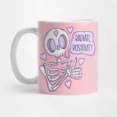 a pink coffee mug with a cartoon skeleton holding a sign reading radiate positivity