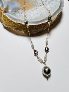 Aquamarine, Tahitian keshi pearl and beautiful 12mm drop shaped Tahitian pearl necklace. Tahitian Pearl Charm Jewelry, Akoya Pearl Teardrop Necklace For Gift, Teardrop Akoya Pearl Necklace Gift, Akoya Pearl Teardrop Pendant Necklace, Teardrop Akoya Pearl Necklace With Pendant, Teardrop Akoya Pearl Drop Necklace, Teardrop Akoya Pearl Necklace, Fine Jewelry Single Strand Briolette Necklace, Fine Jewelry Briolette Pearl Necklace