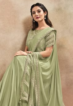 Pista green satin silk saree with blouse 42010  Desc:  Color : Pista Green Saree Fabric : Satin Silk Work : Embroidery Wash Care : Dry clean Sleeve Style : Half Sleeve Long Sleeves : Done only in Custom Stitch Sleeves Lining : Done only in Custom Stitch Bust Size : 34 to 40 Inches Occasion : Wedding   Kitty Party   Mehendi   Sangeet   Party Wear   Reception   Gudi Padwa. With Express Free Shipping and Custom Stitching, Buy Indian Party wedding wear Bridal saris Pista green satin silk saree with Half Saree Designs Simple, Pista Green Saree, Green Sari, Satin Silk Saree, Bridal Sari, Gudi Padwa, Simple Saree Designs, Indian Sari Dress, Pista Green