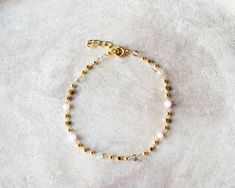 Delicate gold plated rosary chain bracelet with crystal beads in clear and rose quartz tone.It is a beautiful bracelet that looks very nice alone with a minimalist style or layering with other bracelets for a boho style.Simple, delicate and versatile... you'll want in your collection.  🌟💫 #littlebeetlespain #minimalistjewelry #gemstonebracelet #womengift #daintyjewelry #rosarychain #jewelryaccesories #thinbracelets #goldbracelet Adjustable Gold Beaded Chain Rosary Bracelet, Adjustable Gold Beaded Rosary Bracelet, Gold Rose Quartz Bracelets For Jewelry Making, Handmade Dainty Gold Crystal Bracelet, Gold Crystal Bracelet With Beaded Chain For Gift, Adjustable Gold Bracelet With Beaded Chain For Gift, Adjustable Beaded Gold Bracelet Gift, Adjustable Beaded Gold Bracelet As Gift, Dainty Gold Beaded Rosary Bracelet