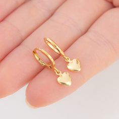 "Title: Puffy Heart Earrings Product Description: Materials & Finish: * 14k Gold Filled over Brass * Waterproof / Hypoallergenic / Lead & Nickel Free Size Specs: * Dangle Chain Length for Maxi Earrings: 1.15\" * Hoop Size: 12mm * Pendant Dimensions: 7mm x 8.5mm Features: * The petite heart design * Handmade with love and attention to detail * All items are packaged in pouch, inside of a high quality and luxurious ready to gift box. * You can find more info on materials, size guide, and jewelry care on the card inside of the package. How to Order:    1- Explore our Collection    2- Select Your Favorites: Once you've found your favorite pieces, click on the product to view detailed information. Select your preferred options, such as metal /material type, gemstone, size, chain type , chain le Tarnish Resistant Gold Plated Dainty Heart Earrings, Hypoallergenic Drop Earrings For Valentine's Day, Valentine's Day Heart Earrings Tarnish Resistant, Valentine's Day Tarnish-resistant Round Earrings, Valentine's Day Tarnish-resistant Heart Earrings, Valentine's Day Heart-shaped Tarnish-resistant Earrings, Heart Charm Round Earrings For Valentine's Day, Valentine's Day Heart Charm Huggie Earrings For Anniversary, Dainty Gold Huggie Earrings For Gift