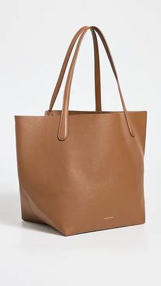 Mansur Gavriel Large Tote Bag | Shopbop Timeless Smooth Grain Shoulder Bag For Shopping, Modern Smooth Grain Shoulder Bag For Shopping, Classic Shopping Bags With Smooth Grain, Brown Saffiano Leather Modern Bags, Modern Brown Saffiano Leather Bag, Brown Saffiano Leather Shoulder Bag For Everyday, Everyday Brown Saffiano Leather Shoulder Bag, Brown Saffiano Leather Bag With Leather Handles, Sleek Leather Shoulder Bag With Smooth Grain