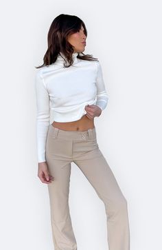 COLOR: BEIGE DETAILS Features a low rise, relaxed leg, front zipper and button fastening, overlap waistband detailing and belt loops with button closures stretch 75% Polyester, 20% Rayon, 5% Elastane Please refer to the care label for garment care instructions SIZE & FIT: runs TTS, models wear size S MODEL INFO: HEIGHT 5’6, WAIST 25in, BUST 32in Chic Beige Cropped Bottoms, Fitted Beige Bottoms With Buttons, Chic Mid-rise Bottoms With Button Zip Fly, Fitted Mid-rise Bottoms With Buttons, Cropped Bottoms With Belt Loops For Workwear, Fitted Cropped Beige Pants, Beige Fitted Cropped Pants, Elegant Cropped Beige Bottoms, Cropped Bottoms With Button Closure For Fall