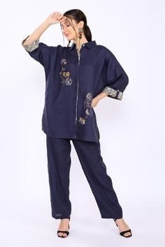 Navy shirt with floral embroidery and cuff sleeves. Blue Cotton Top With Embroidered Sleeves, Cotton Embroidered Cuff Long Sleeve Top, Linen Pants Outfit Fall, Blue Linen Pants Outfit, Navy Blue Linen Pants, Long Sleeve Embroidered Blue Tunic, Spring Blue T-shirt With Floral Embroidery, Blue Floral Embroidered Tunic Kurta, Blue Linen Pants