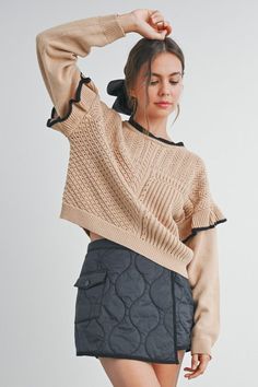 Elevate your style with our Ruffled Shoulder Knitted Sweater. Crafted from a soft, cozy knit, this sweater features charming ruffled shoulders that add a touch of femininity and flair. Perfect for both casual outings and dressier occasions, it pairs beautifully with jeans or skirts. Available in a range of versatile colors, this sweater is a must-have addition to your wardrobe for a chic, effortless look. Feminine Pointelle Knit Sweater For Spring, Feminine Sweater For Winter Day Out, Feminine Sweater For Day Out In Winter, Feminine Winter Sweater For Day Out, Chic Cropped Sweater With Pointelle Knit And Long Sleeves, Chic Pointelle Knit Cropped Sweater With Long Sleeves, Chic Long Sleeve Pointelle Knit Cropped Sweater, Chic Long Sleeve Pointelle Cropped Sweater, Feminine Long Sleeve Sweater For Day Out