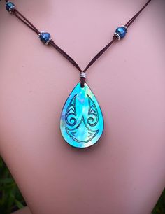 One of a kind Moana necklace. Hand carved from New Zealand  Paua shell with natural bright pearly blue/green with flashes of purple. Hand carved Maori design to symbolise strength and growth, bringing connections to the Ocean. And the spirit of Moana. I have engraved a Manta Ray design as a symbol from the Sea. The Manta Ray Spirit teaches us how to stop overextending ourselves, showing us how to go with the flow and glide a little more often. It brings strength and confidence whenever we're outside our comfort zone. I have added natural pearl beads to the necklace to complete the Moana look. A little piece of treasure from Sea shores of New Zealand. Perfect for an Ocean or Moana lover. Moana is the Maori word for Sea. New Zealand Paua shell is known for its vibrant iridescent colours & is Moana Necklace, Paua Shell Necklace, Manta Ray, Go With The Flow, Paua Shell, Shell Necklace, Natural Pearl, Shell Necklaces, Comfort Zone