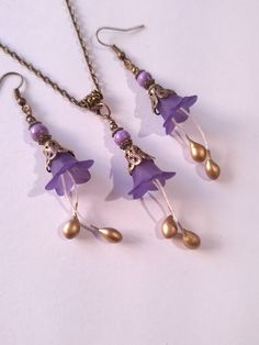 Purple Turquoise flower jewelry set purple flower set necklace earrings purple Turquoise flower bronze jewelry set purple Boho set gift for her Gorgeous  Victorian style jewelry set necklace and earrings . Bohemian necklace and earrings . Beautiful Set of bronze-tone filigree ornaments and rare purple Turquoise and purple plastic flowers necklace and earrings. Bronze Victorian style necklace and earrings. Boho necklace. Bohemian necklace and earrings. Romantic necklace and earrings. Royal style Bohemian Metal Jewelry With Flower Charm, Bohemian Flower Jewelry For Her, Bohemian Flower Jewelry As A Gift For Her, Bohemian Flower Jewelry As Gift For Her, Nickel-free Flower-shaped Jewelry For Jewelry Making, Bohemian Flower Shaped Jewelry As A Gift, Bronze Flower-shaped Jewelry Gift, Handmade Metal Flower Jewelry, Lavender Flower Jewelry With Matching Earrings