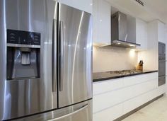 a kitchen with stainless steel appliances and white cabinets